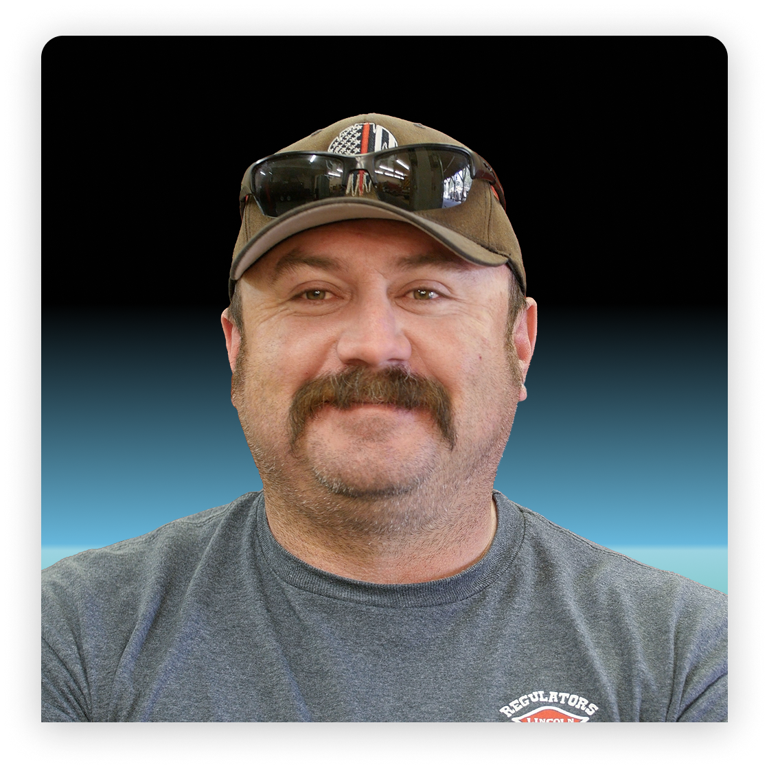 Picture of a man in a hat smiling